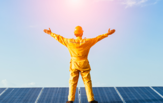 man standing on top of solar panel