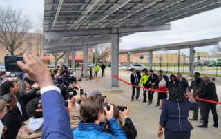 cutting the ribbon for solar energy project